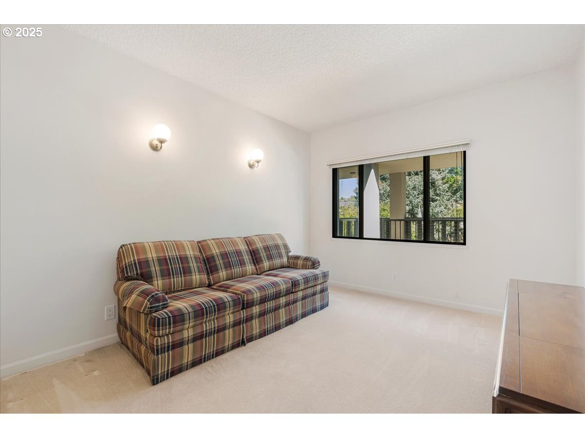 790 Southeast Webber Street, Unit 305 Portland, OR 97202 - Photo 25 of 30 a living room with furniture and a window