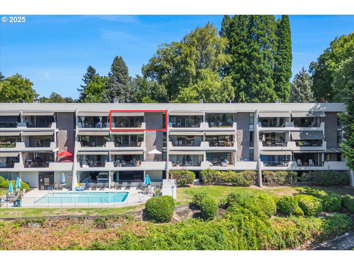 790 Southeast Webber Street, Unit 305 Portland, OR 97202 - Photo 30 of 30 a view of a house with a garden and plants