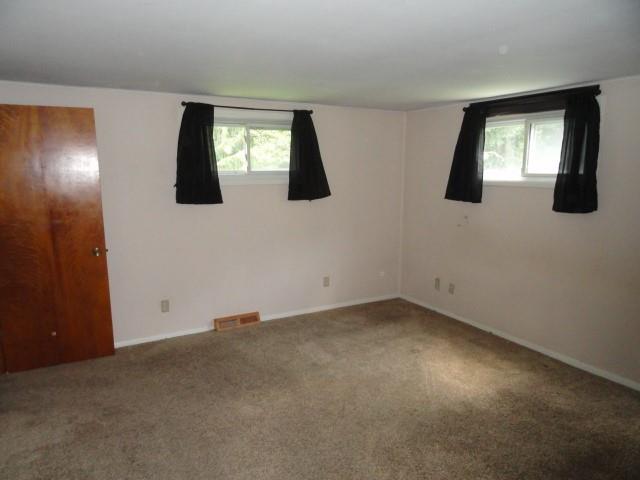 121 North Ridge Road Butler, PA 16001 - Photo 9 of 13 an empty room with windows and mirror