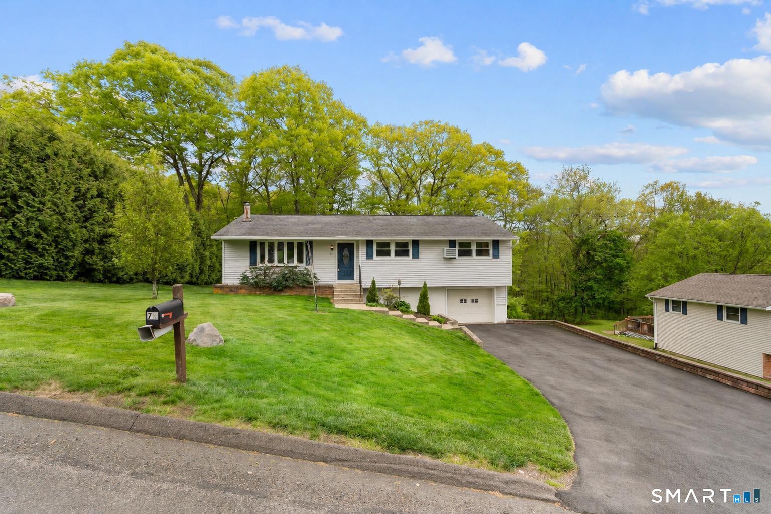 79 Forest View Drive Wolcott, CT 06716 - Photo 1 of 28 front view of a house with a yard