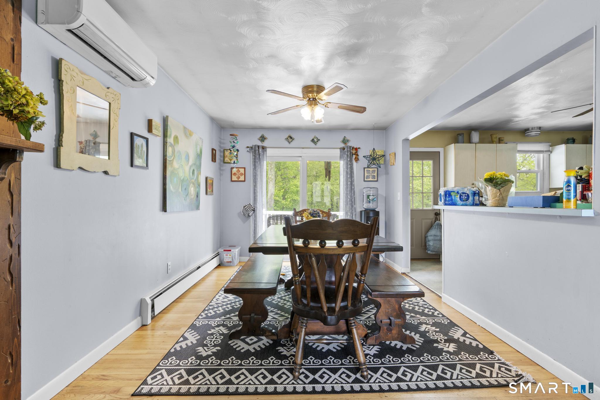 79 Forest View Drive Wolcott, CT 06716 - Photo 12 of 28 a dining room with chandelier fan and wooden floor