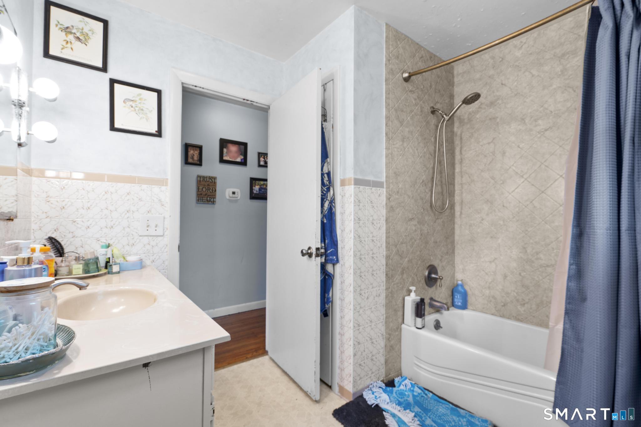 79 Forest View Drive Wolcott, CT 06716 - Photo 17 of 28 a bathroom with a sink a bathtub and a shower