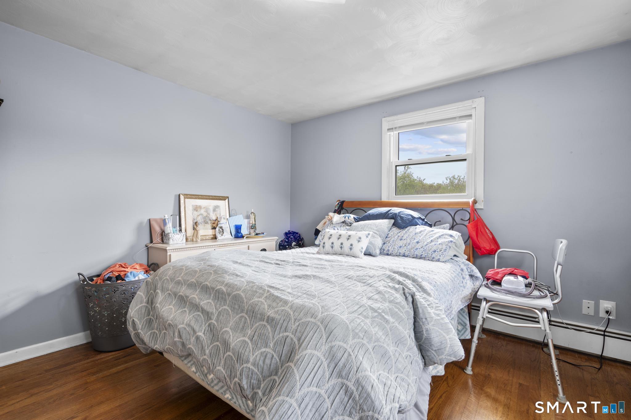 79 Forest View Drive Wolcott, CT 06716 - Photo 18 of 28 a bedroom with a bed and a desk