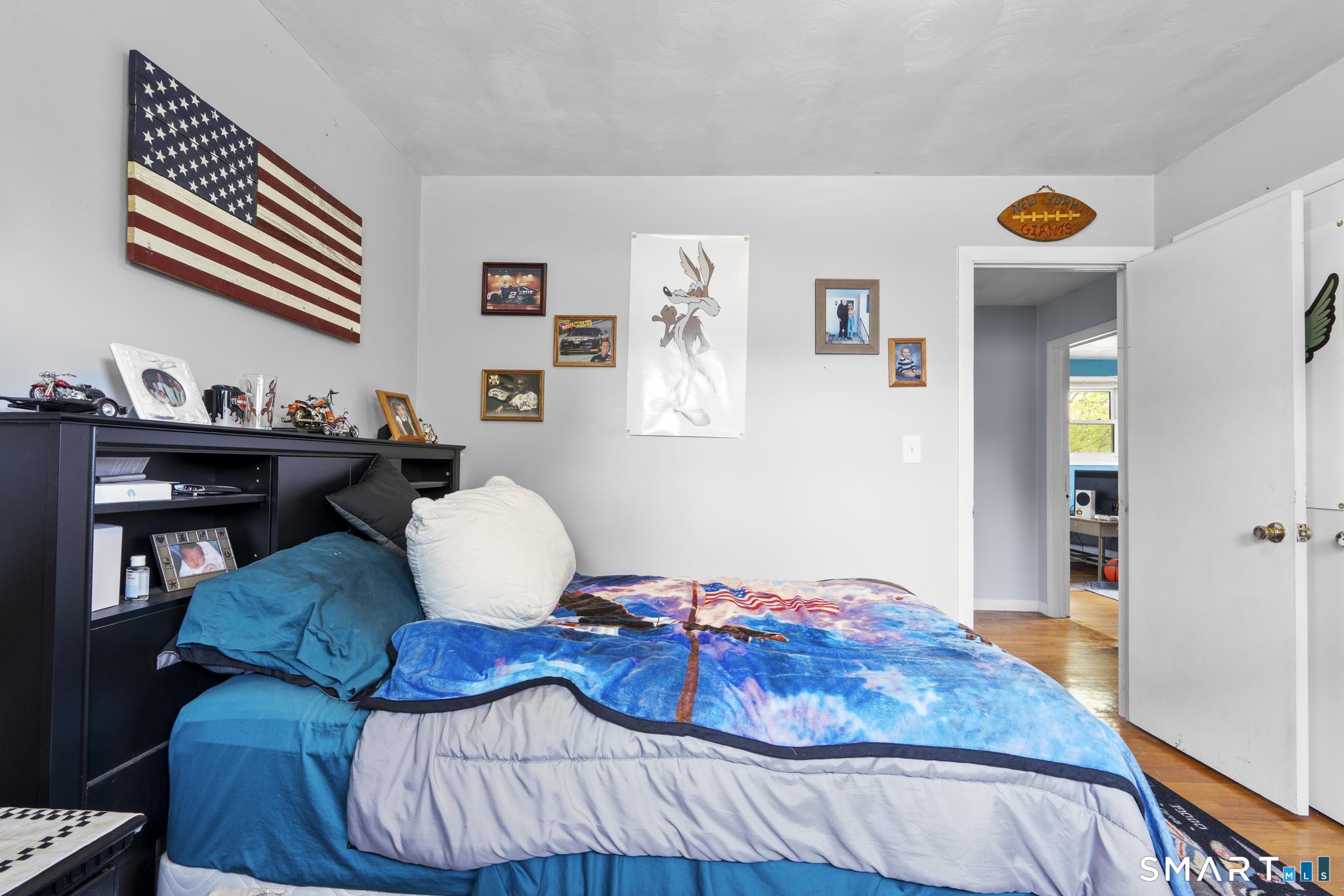 79 Forest View Drive Wolcott, CT 06716 - Photo 19 of 28 a bedroom with a bed and a painting on the wall