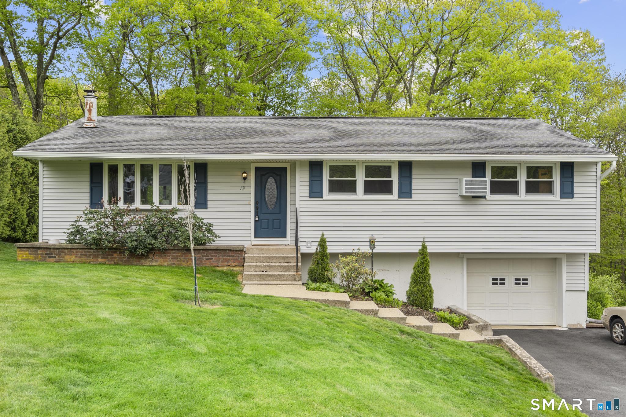 79 Forest View Drive Wolcott, CT 06716 - Photo 2 of 28 a front view of house with yard and green space