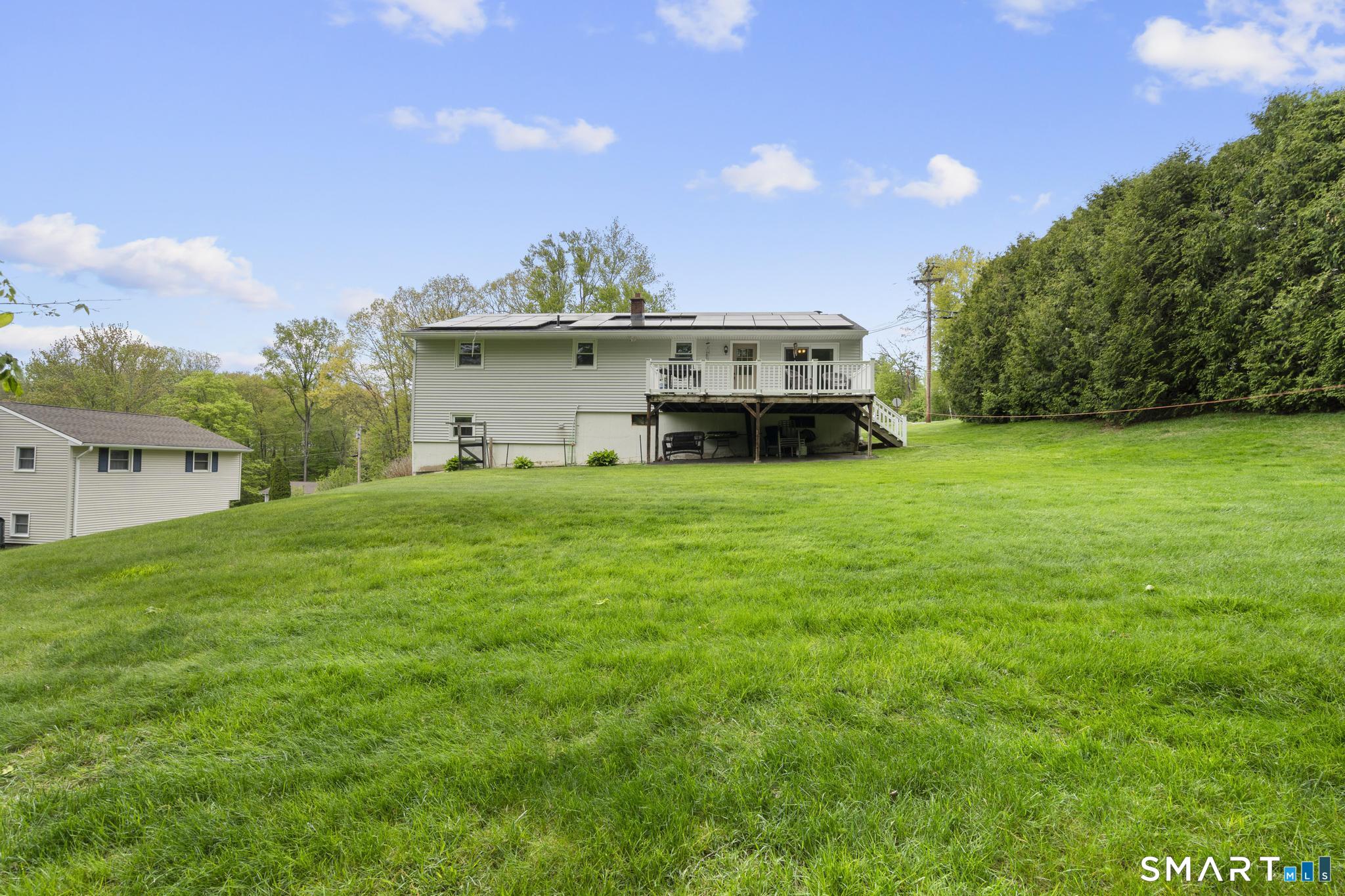 79 Forest View Drive Wolcott, CT 06716 - Photo 6 of 28 a view of a house with a yard and sitting area