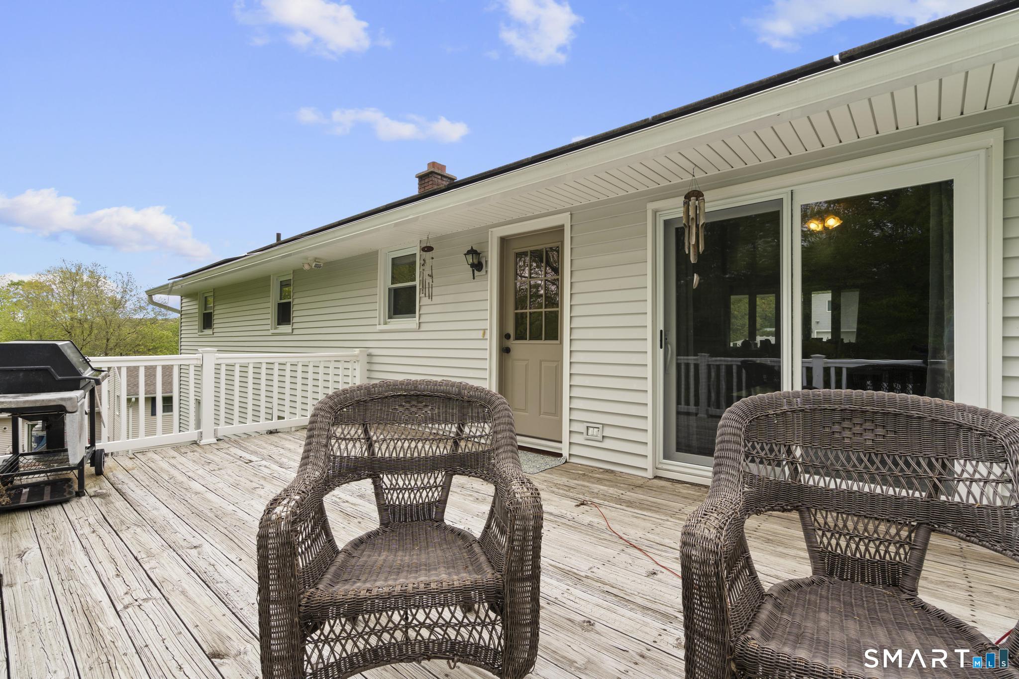 79 Forest View Drive Wolcott, CT 06716 - Photo 8 of 28 a balcony with furniture and wooden floor