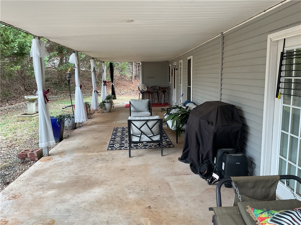 229 Cub Cove Drive Walhalla, SC 29691 - Photo 49 of 50 This inviting patio offers a serene outdoor retreat, perfect for relaxation and entertaining.