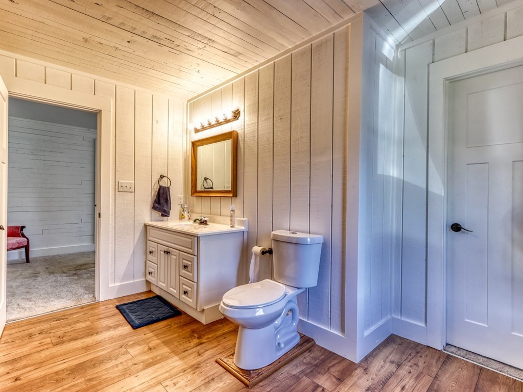 2712 Hodges Ferry Road Kodak, TN 37764 - Photo 23 of 49 a bathroom with a granite countertop sink toilet a mirror and shower