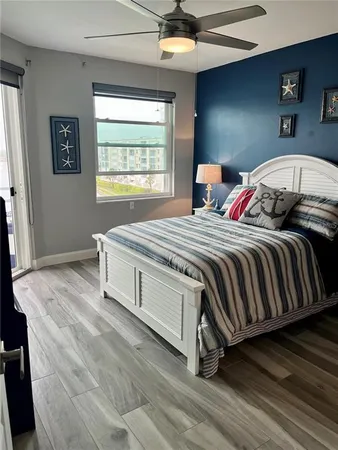 a bedroom with bed and a window