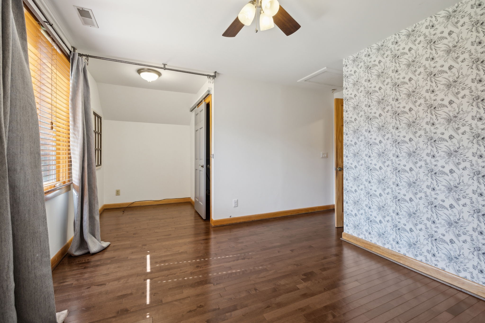 1208 Davidson Lane Columbia, TN 38401 - Photo 56 of 85 a view of an empty room with wooden floor and a window