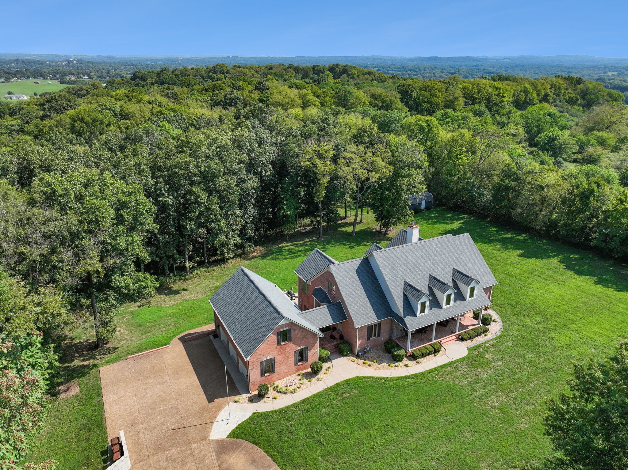 1208 Davidson Lane Columbia, TN 38401 - Photo 77 of 85 a view of a backyard with lawn chairs floor to ceiling window and grass