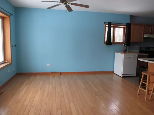 a kitchen with stainless steel appliances granite countertop a stove and a refrigerator