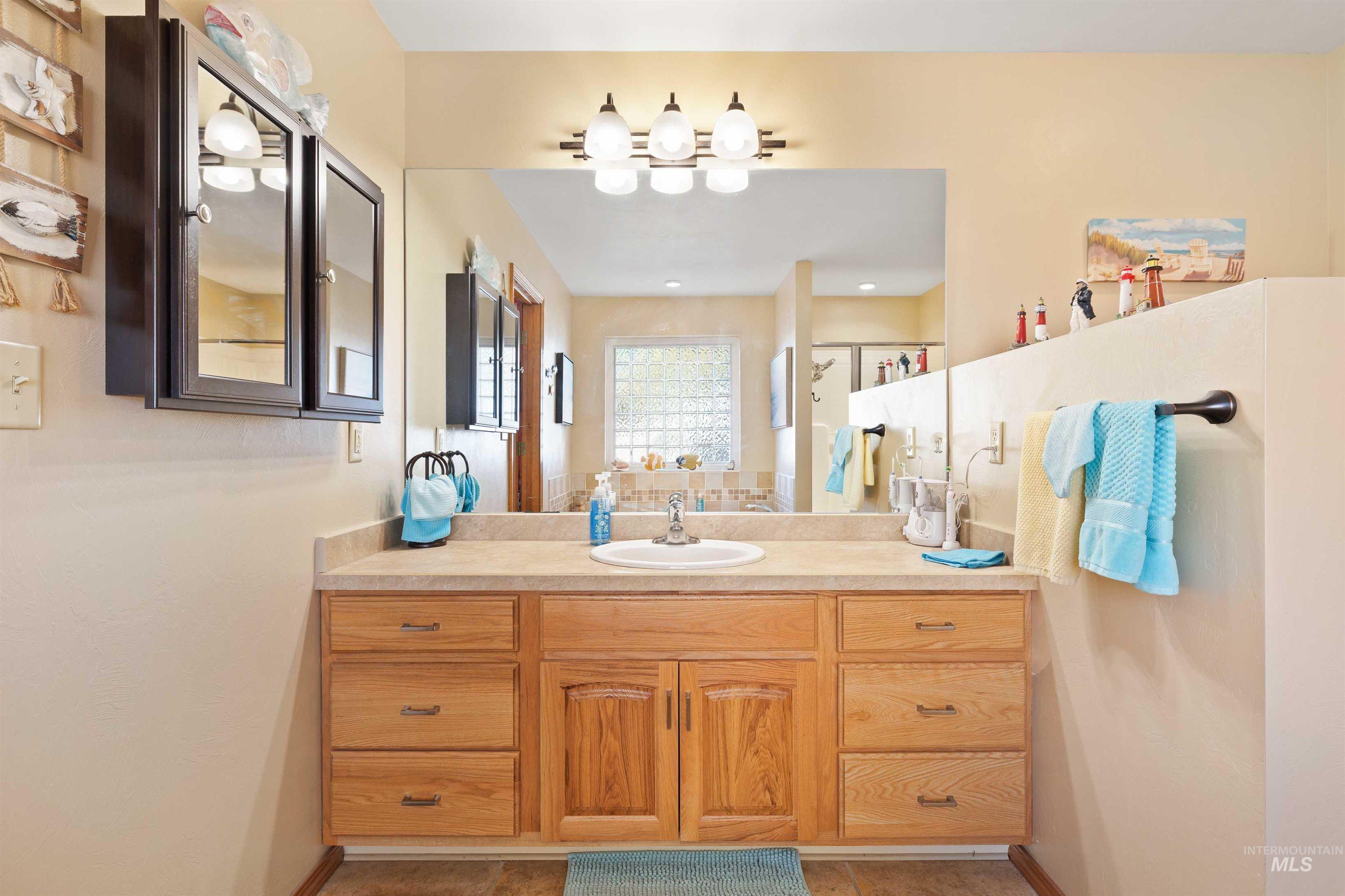 430 Pierce Street Twin Falls, ID 83301 - Photo 15 of 39 Full bath featuring vanity and a stall shower