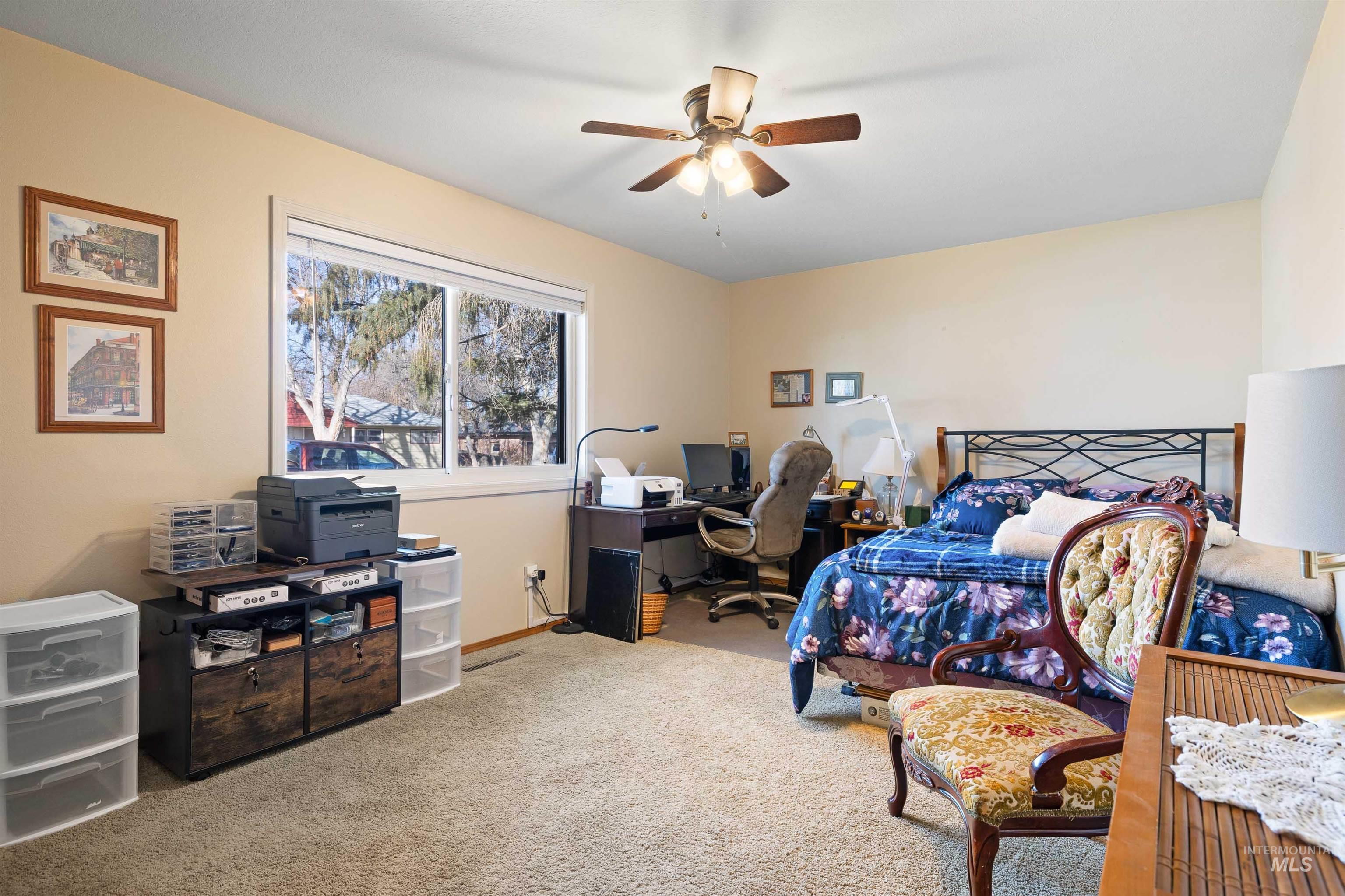 430 Pierce Street Twin Falls, ID 83301 - Photo 16 of 39 Bedroom featuring a desk, light carpet, and ceiling fan