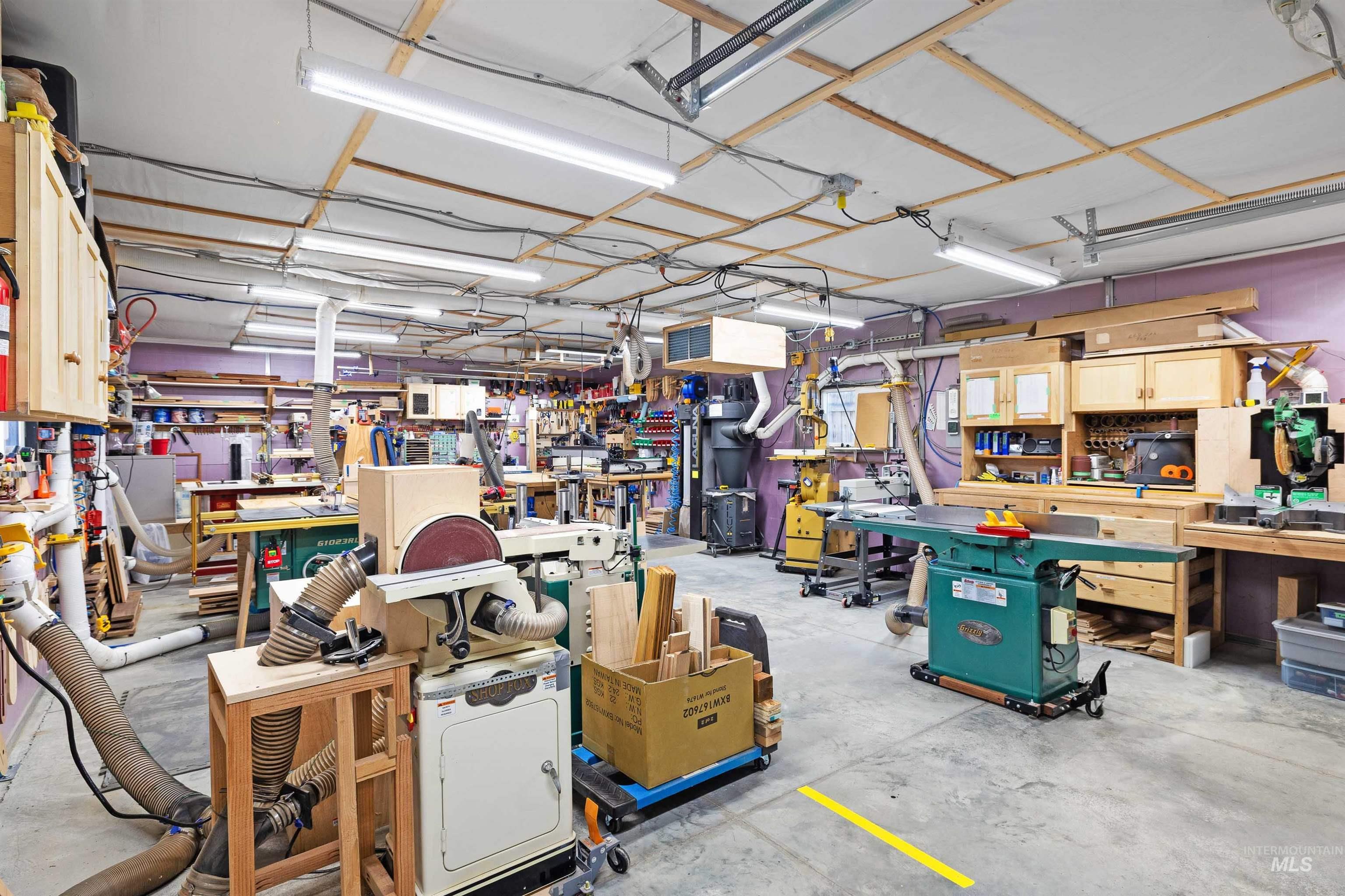 430 Pierce Street Twin Falls, ID 83301 - Photo 23 of 39 Garage with a workshop area and a heating unit