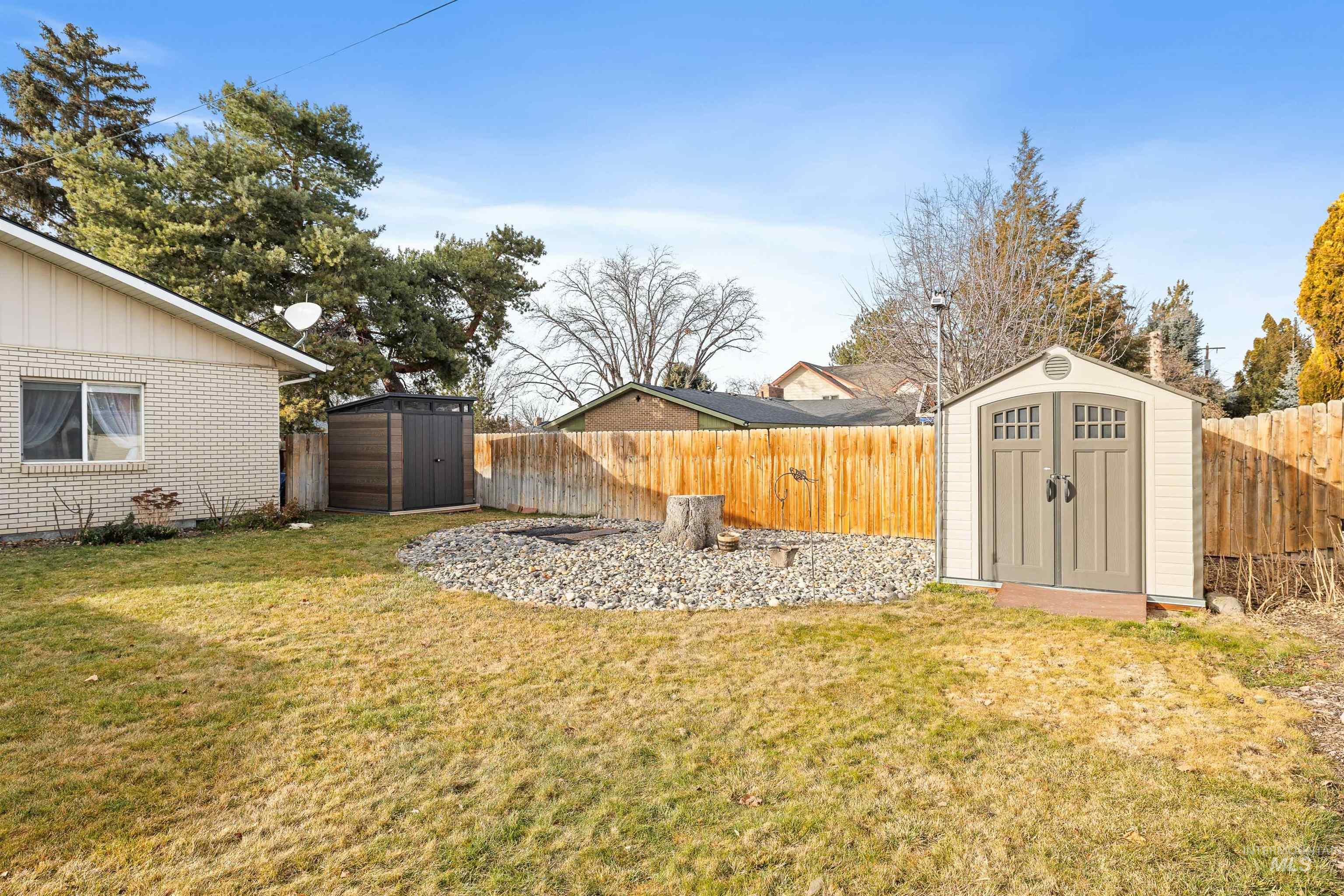 430 Pierce Street Twin Falls, ID 83301 - Photo 27 of 39 Fenced backyard with a storage shed