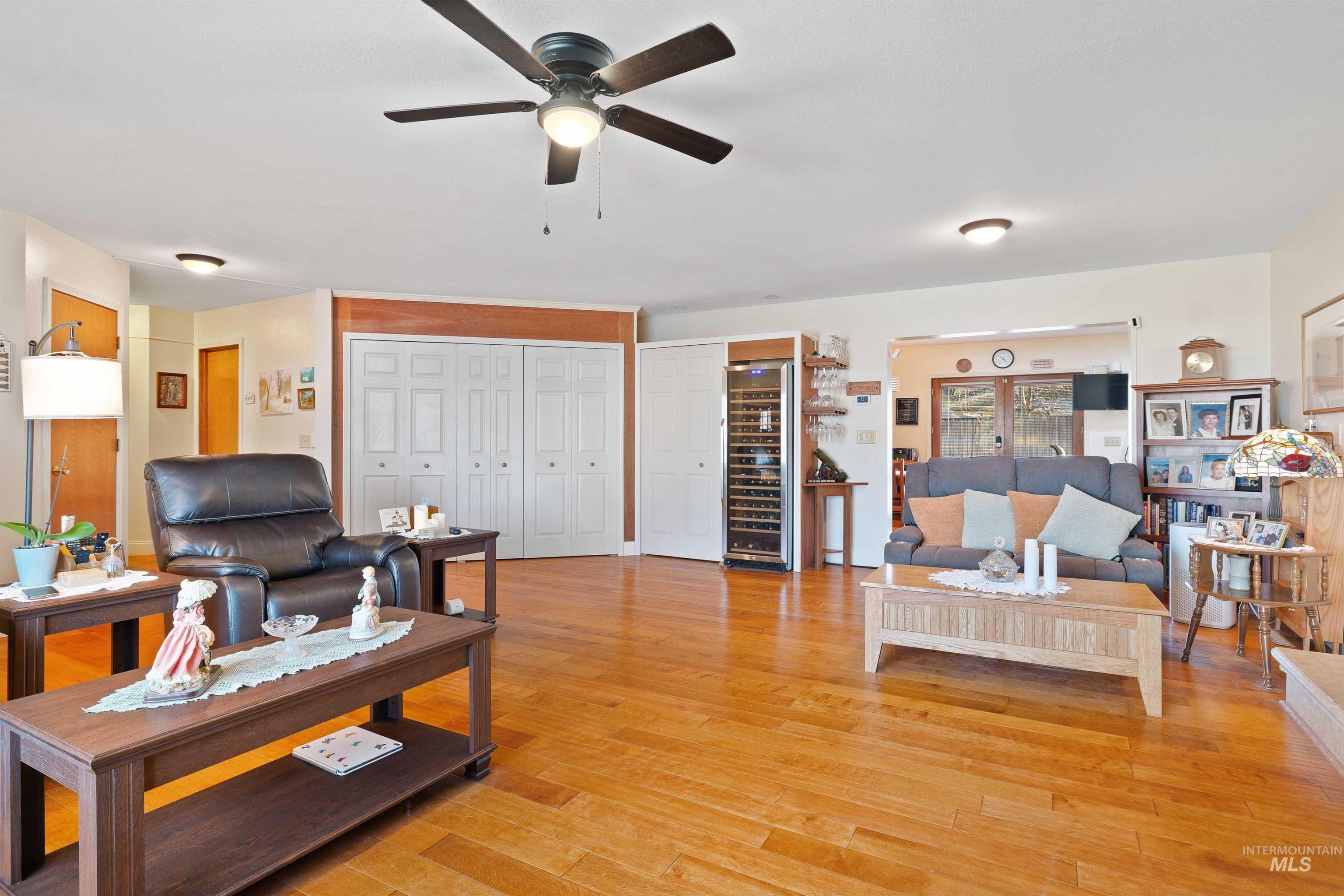 430 Pierce Street Twin Falls, ID 83301 - Photo 7 of 39 Living room featuring light wood-type flooring, wine cooler, and a ceiling fan