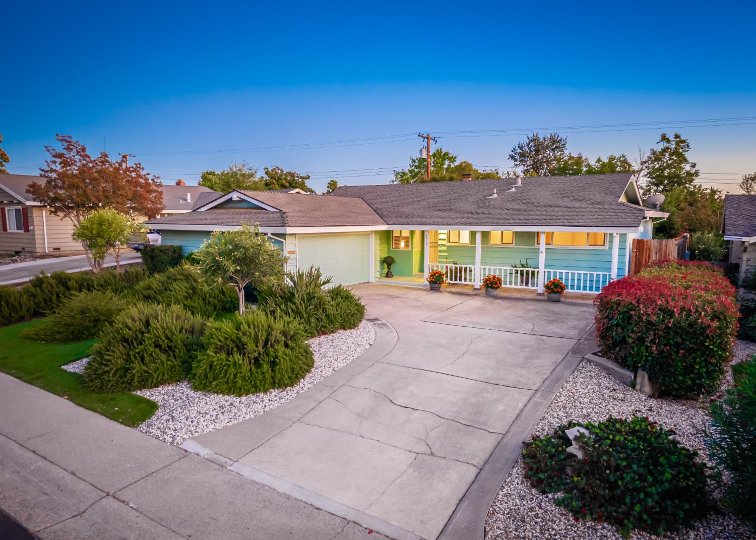 5310 Fort Sutter Way Sacramento, CA 95841 - Photo 1 of 55 a front view of a house with a yard and outdoor seating