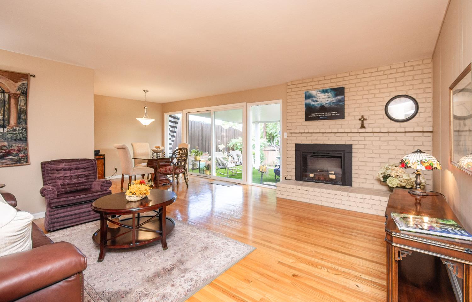5310 Fort Sutter Way Sacramento, CA 95841 - Photo 11 of 55 a living room with furniture a fireplace and a table