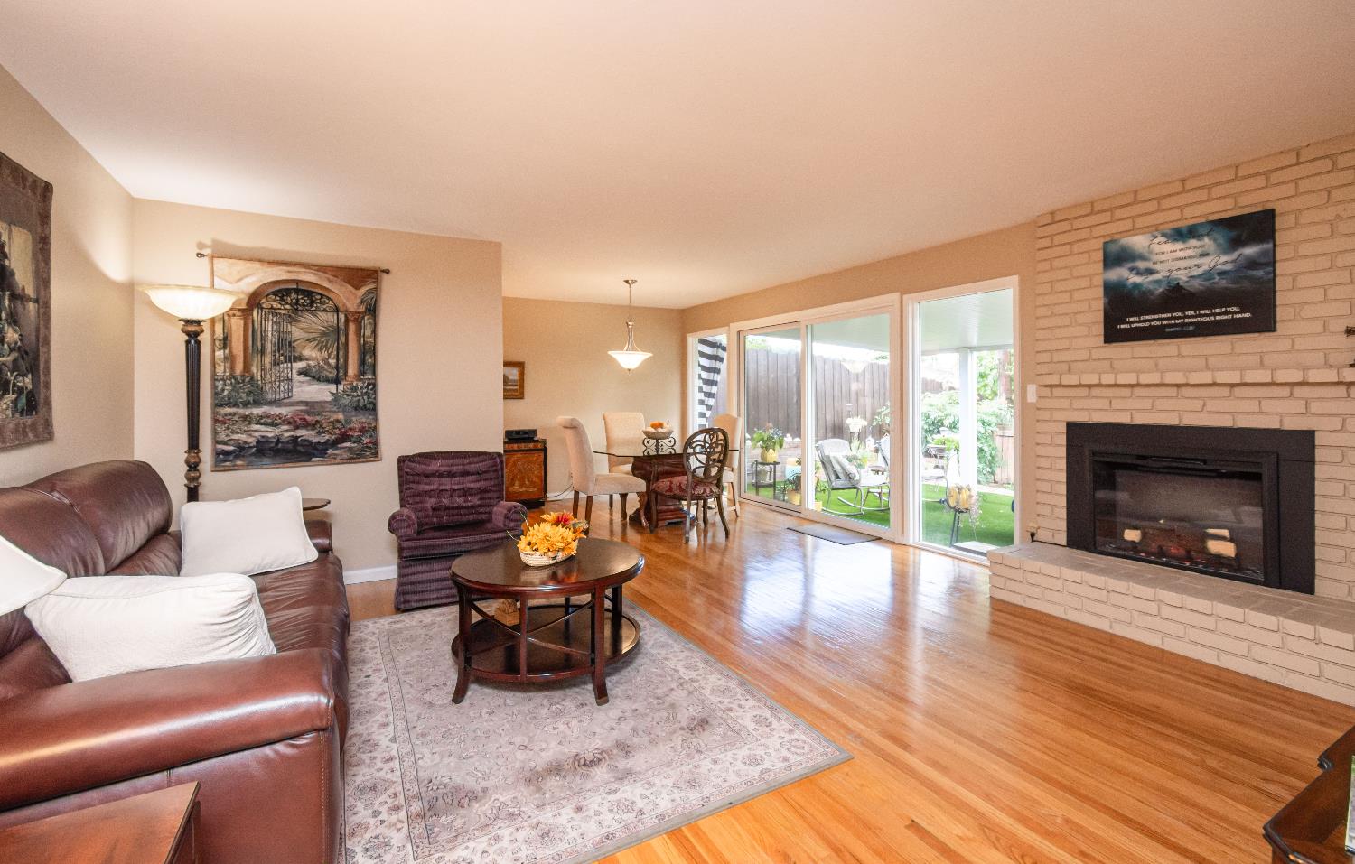5310 Fort Sutter Way Sacramento, CA 95841 - Photo 12 of 55 a living room with furniture large window and a fireplace