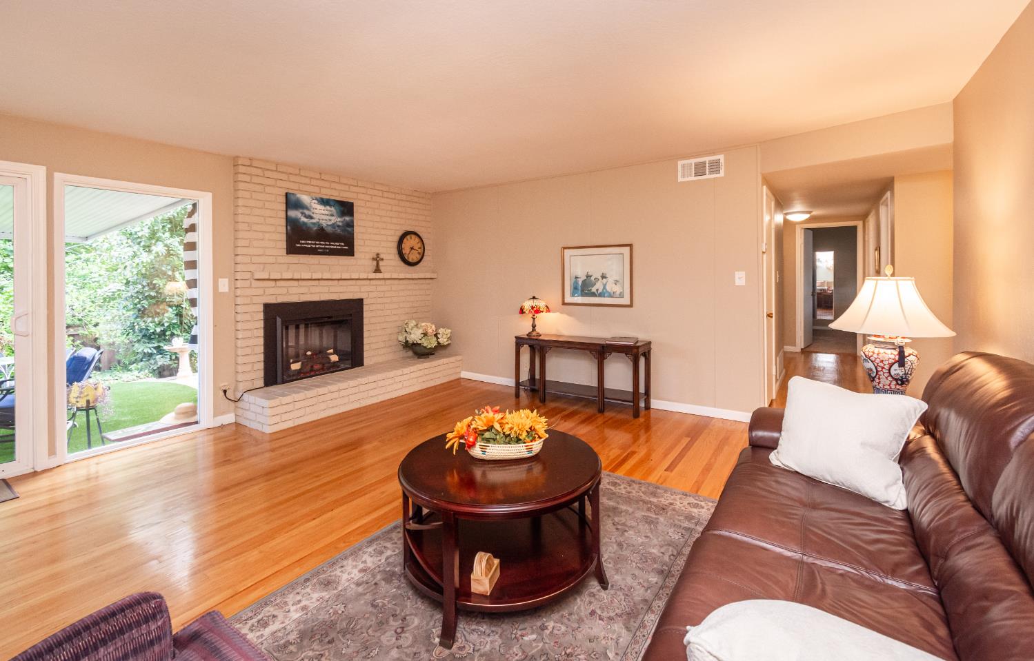 5310 Fort Sutter Way Sacramento, CA 95841 - Photo 15 of 55 a living room with furniture and a fireplace