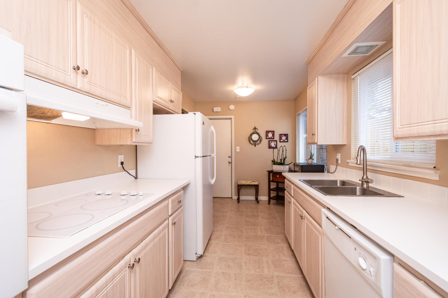 5310 Fort Sutter Way Sacramento, CA 95841 - Photo 20 of 55 a kitchen with a sink stove and cabinets