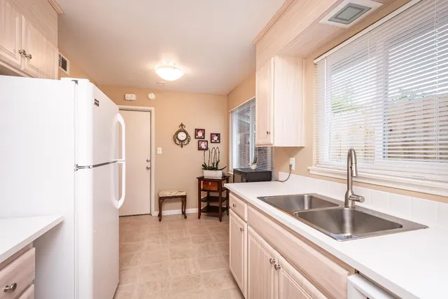 a room with furniture a rug and a window