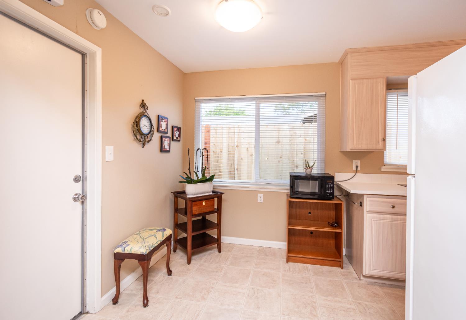5310 Fort Sutter Way Sacramento, CA 95841 - Photo 24 of 55 a room with furniture a rug and a window