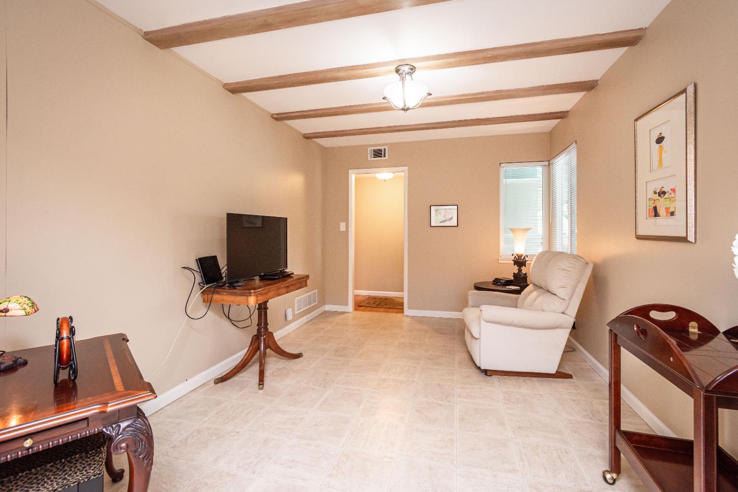 5310 Fort Sutter Way Sacramento, CA 95841 - Photo 26 of 55 a living room with furniture and a flat screen tv