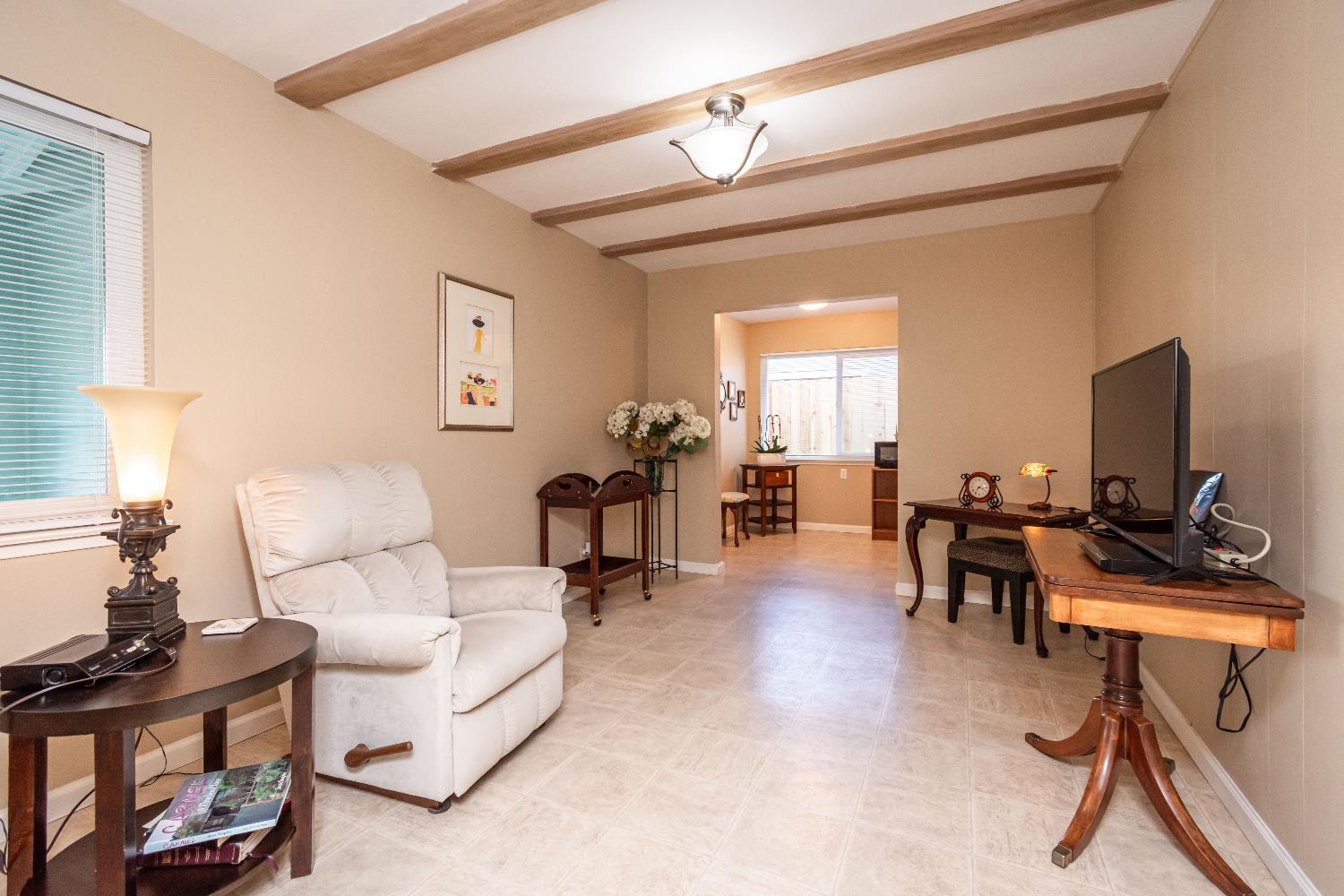 5310 Fort Sutter Way Sacramento, CA 95841 - Photo 27 of 55 a living room with furniture and a flat screen tv