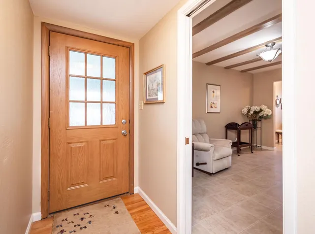 a bathroom with a granite countertop toilet sink and mirror