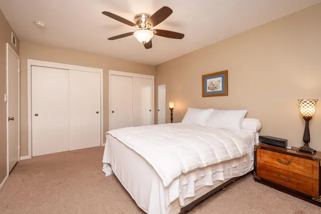 a bathroom with a granite countertop sink and shower
