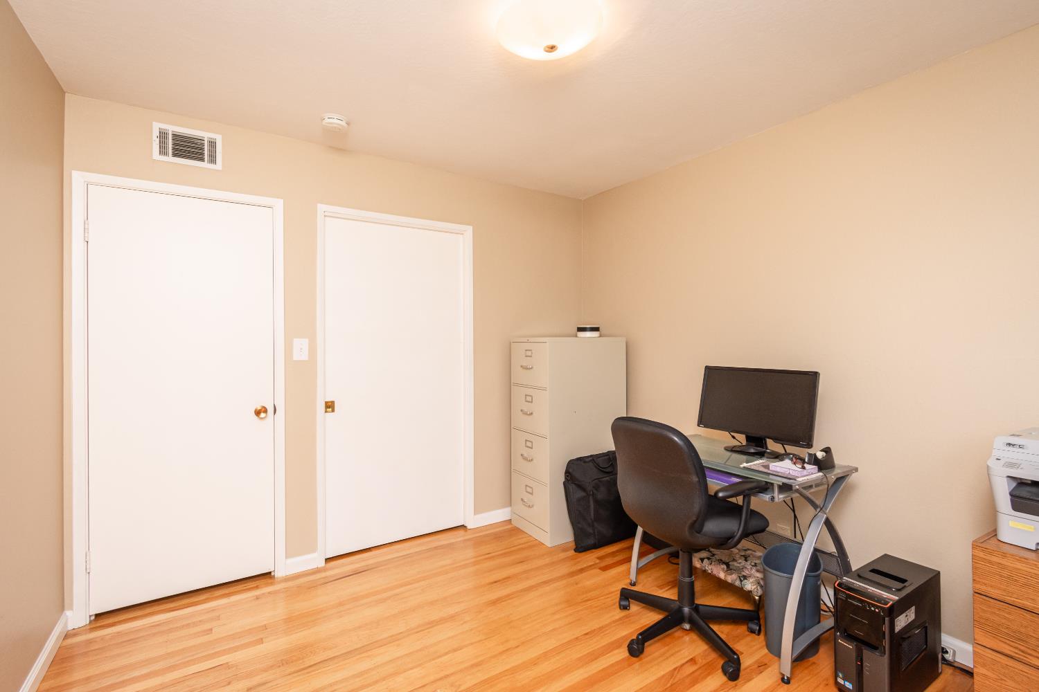 5310 Fort Sutter Way Sacramento, CA 95841 - Photo 35 of 55 a view of workspace with wooden floor windows