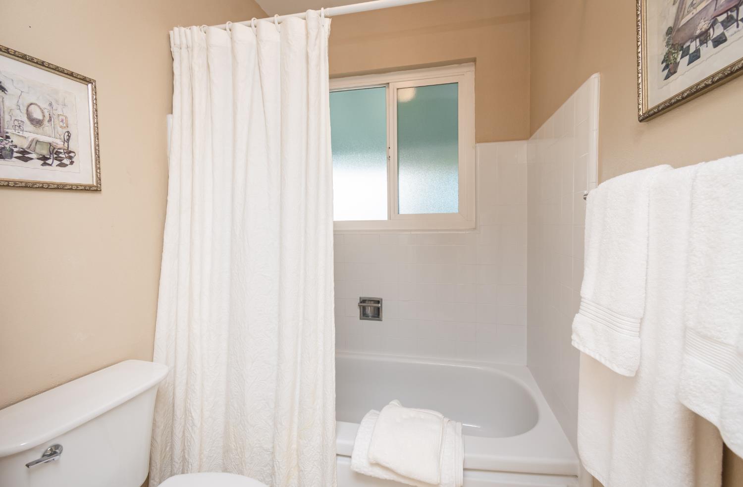 5310 Fort Sutter Way Sacramento, CA 95841 - Photo 37 of 55 a bathroom with a bathtub and shower