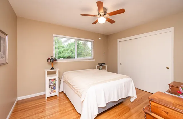 a backyard of a house with a table and chairs