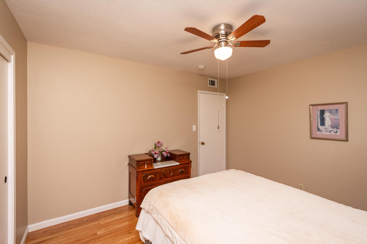 5310 Fort Sutter Way Sacramento, CA 95841 - Photo 39 of 55 a bedroom with a bed and a ceiling fan
