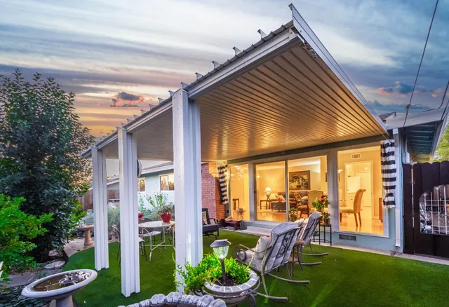 a outdoor view with a sitting space garden and furniture