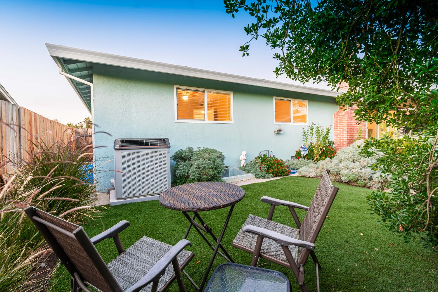 5310 Fort Sutter Way Sacramento, CA 95841 - Photo 51 of 55 a view of a chairs and table in backyard of the house