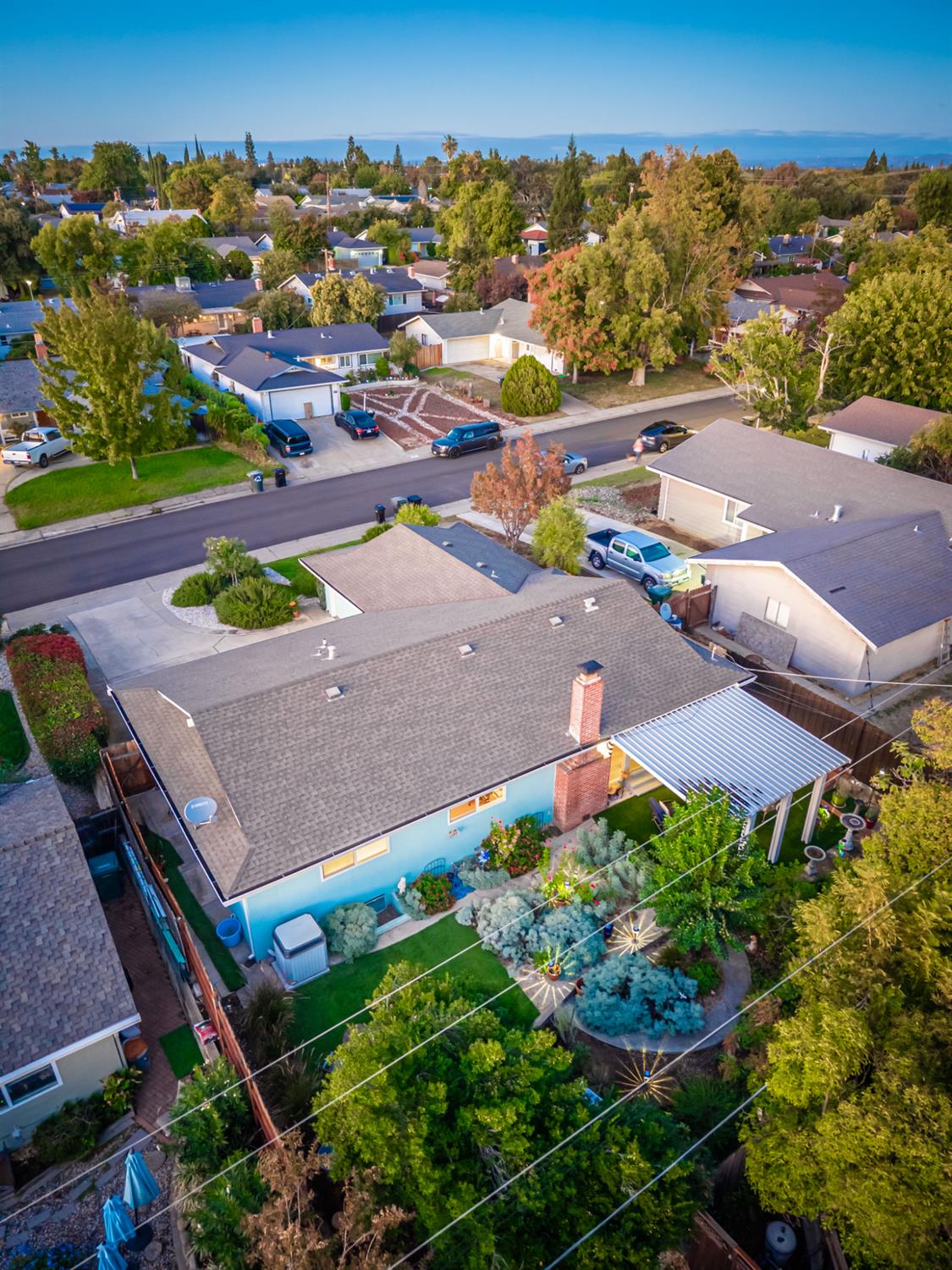 5310 Fort Sutter Way Sacramento, CA 95841 - Photo 55 of 55 an aerial view of a house with a garden and mountains in the background