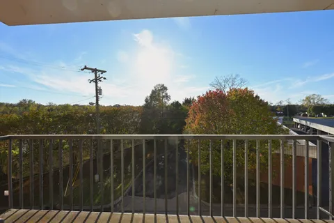 a view of balcony and wooden floor