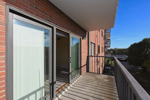a hallway with toys and a chandelier
