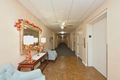 a workspace with furniture and window