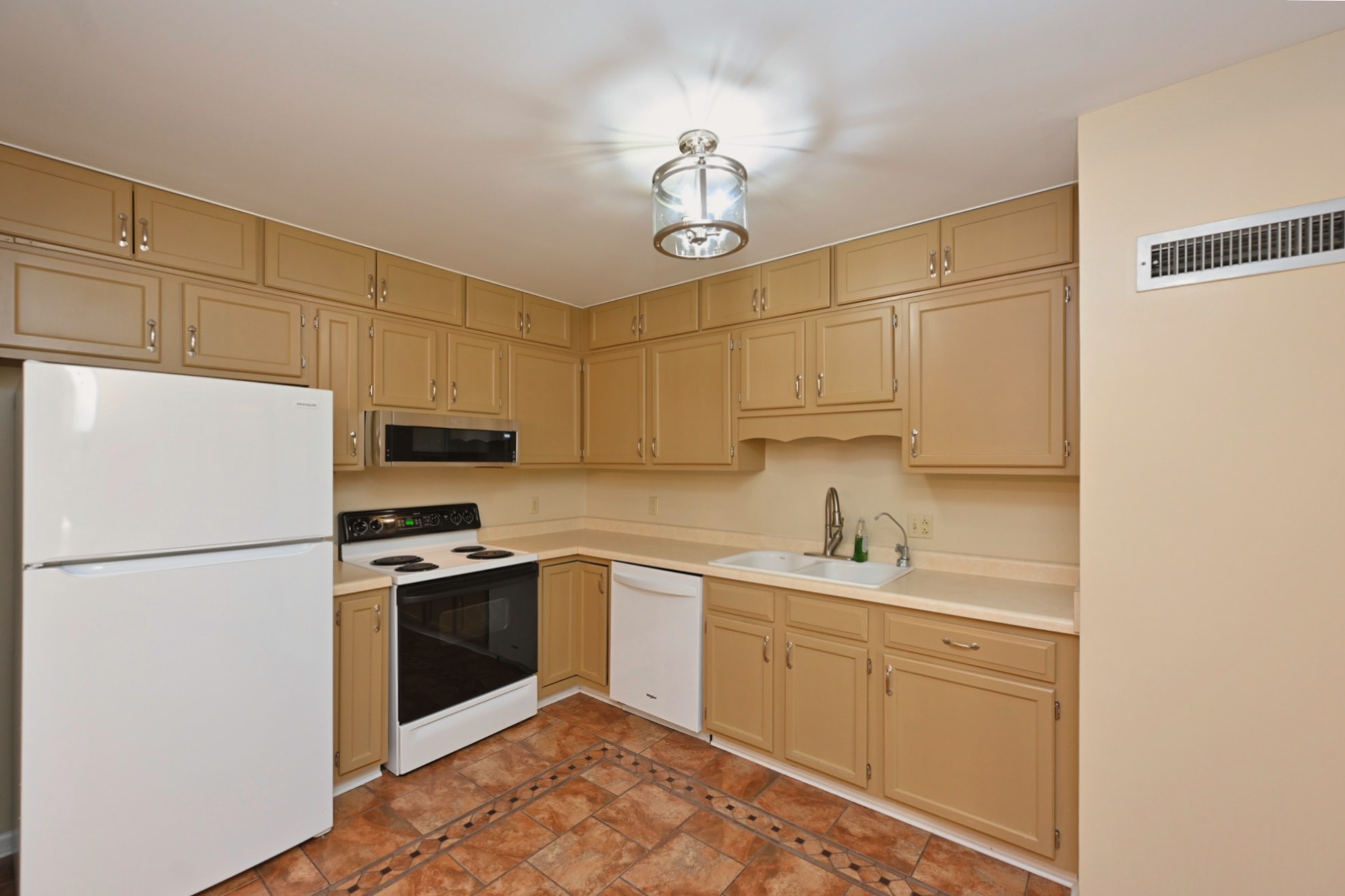 200 Sanders Ferry Road, Unit 2307 Hendersonville, TN 37075 - Photo 8 of 29 a kitchen with stainless steel appliances granite countertop a sink a stove a refrigerator a white stove top oven and white cabinets