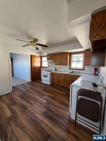 a kitchen with stainless steel appliances granite countertop a stove and a refrigerator