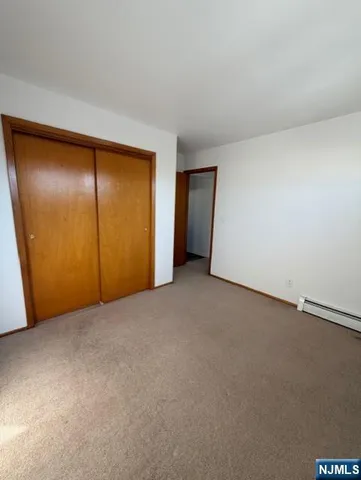 an empty room with a empty space and windows