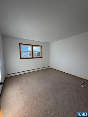 a view of an empty room and entryway