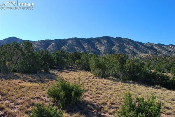 a view of mountains and valleys