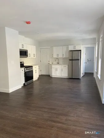 a view of kitchen with wooden floor