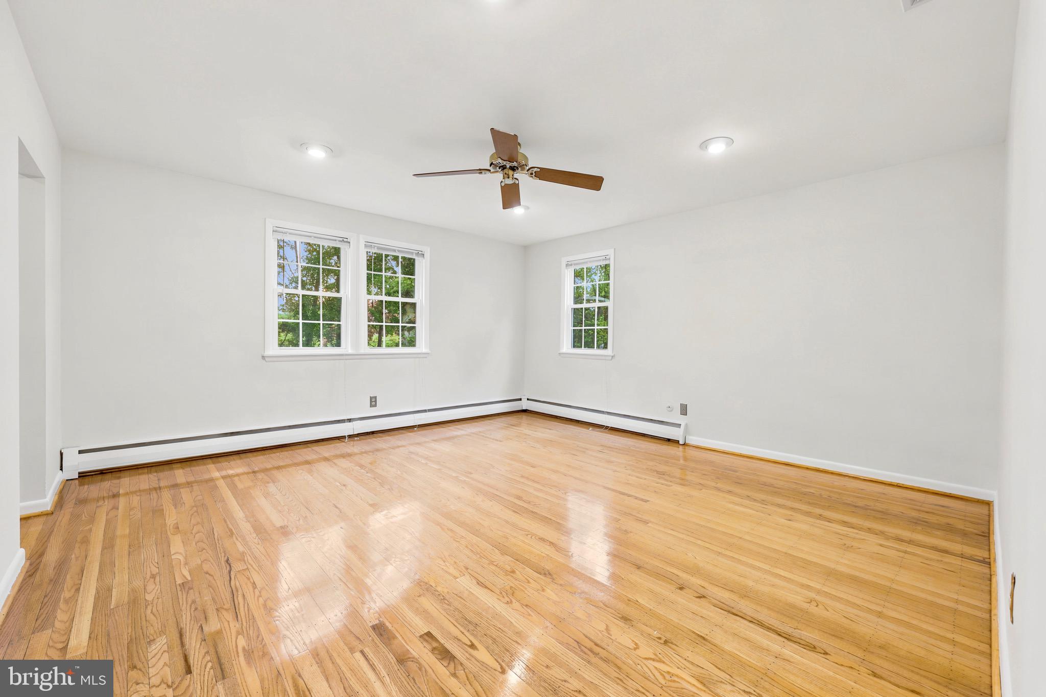 412 Yorkshire Road Bryn Mawr, PA 19010 - Photo 15 of 25 an empty room with a window and a ceiling fan